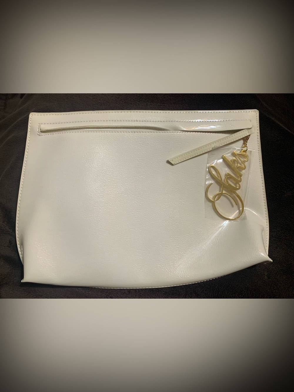 SAKS FIFTH AVENUE creme’ color patent leather Zip close accessory bag LNWOT
